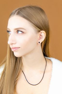 Silver stud earrings with black enamel