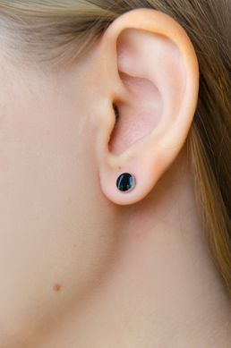 Silver stud earrings with black enamel